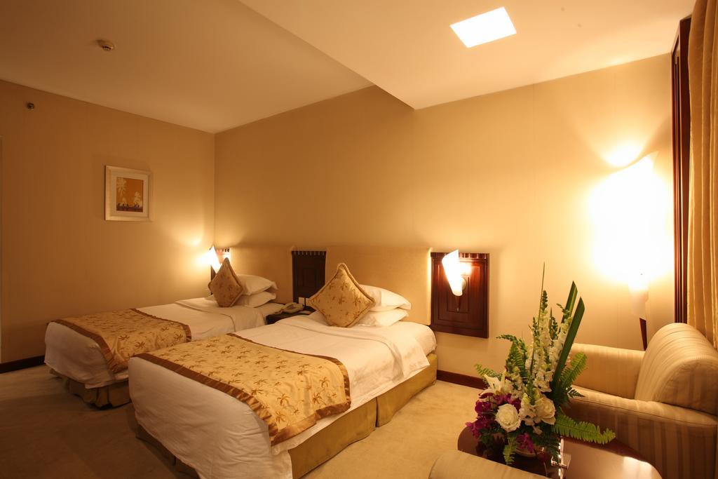 Beijing Wuhuan Hotel Habitación foto