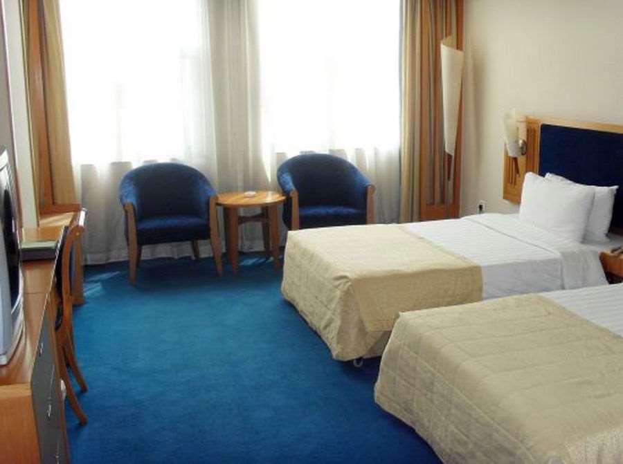 Beijing Wuhuan Hotel Habitación foto