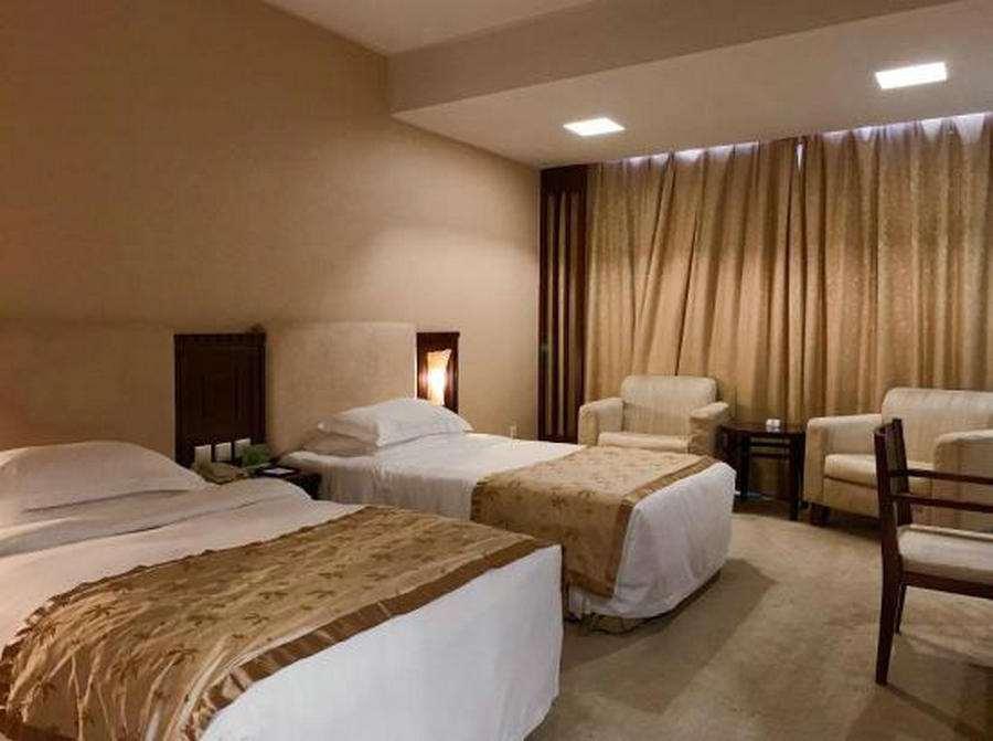 Beijing Wuhuan Hotel Habitación foto