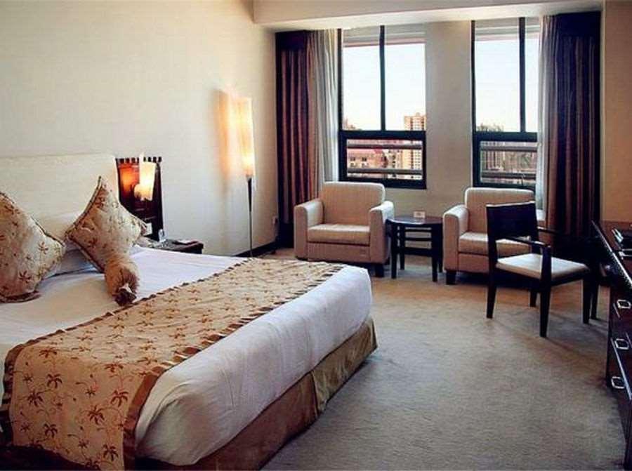 Beijing Wuhuan Hotel Habitación foto